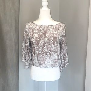 Olivaceous rayon cropped blouse with ruffle sleeves and cutout back design.
